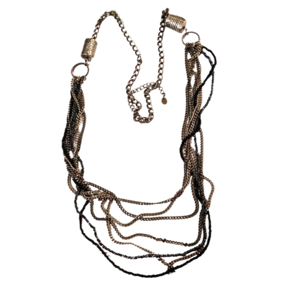 Multi Strand chains and seed beads, tribal cylinders.
